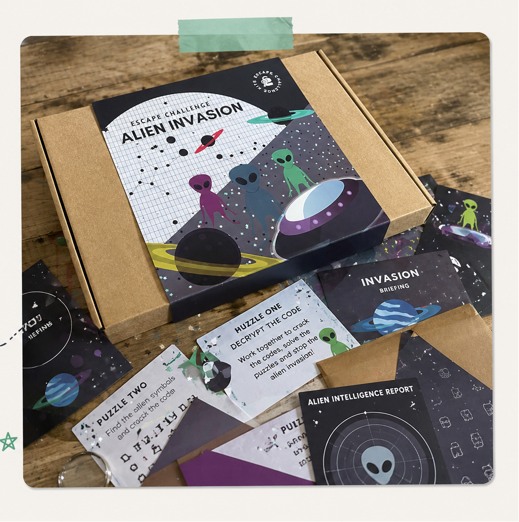 Escape room challenge set with 'Alien Invasion' theme on a wooden surface